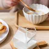 Tasse en verre compacte au design de carton de lait