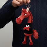"Cheval Audacieux - Porte-clés Rouge et Noir" could be rephrased as "Porte-clés Audacieux en Rouge et Noir - Cheval".