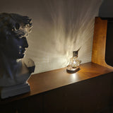 Lampe de table en verre au design de pierre de glace
