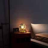 Lampe de table en verre au design de pierre de glace