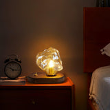 Lampe de table en verre au design de pierre de glace
